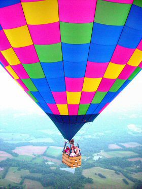 A colorful hot air balloon with people inside to show flight safety.